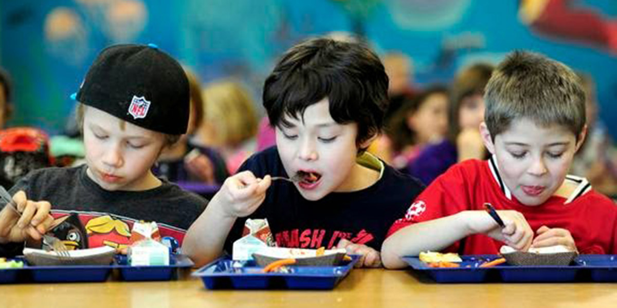 (Left to right) Adrik Anderson, 8, Jack Good, 8, and Aaron Gilbert, 9, eat lunch at Douglas Elementary in Boulder, Colorado January 24, 2013.  DAILY CAMERA/ MARK LEFFINGWELL